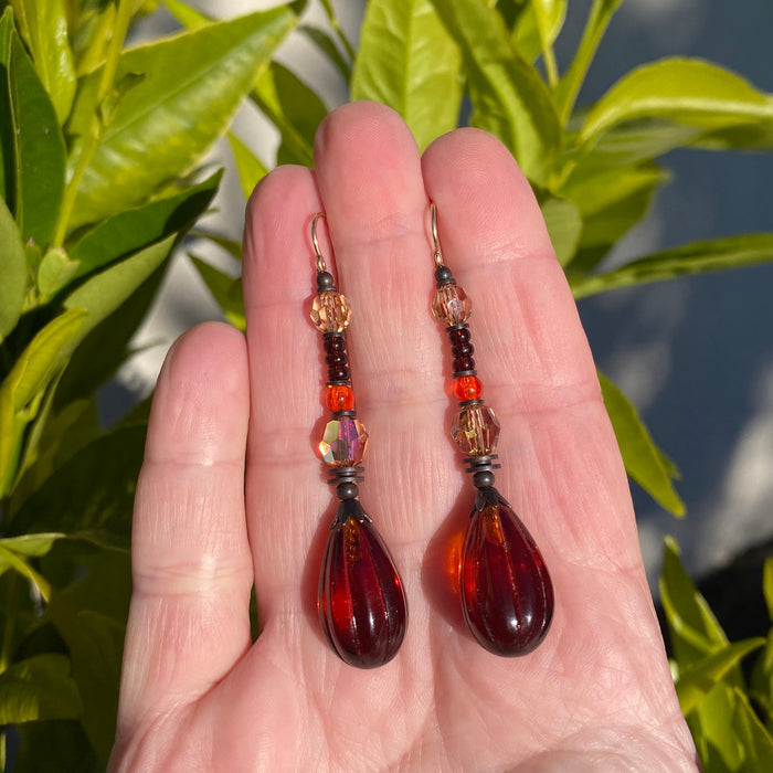 Dark Topaz Seedpod glass drop earrings with Austrian crystal accents from Owen Glass Collection, featuring intricate glass leaf designs.