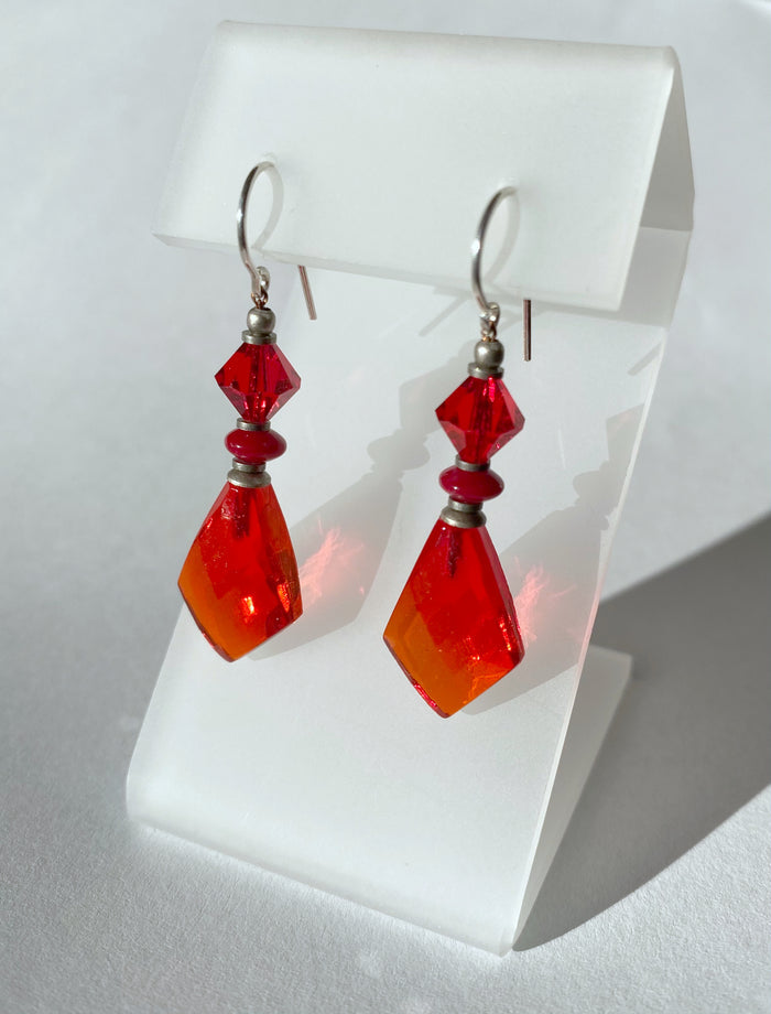 Red glass earrings from Owen Glass Collection, featuring vibrant, handcrafted glass earrings with a bold red color.