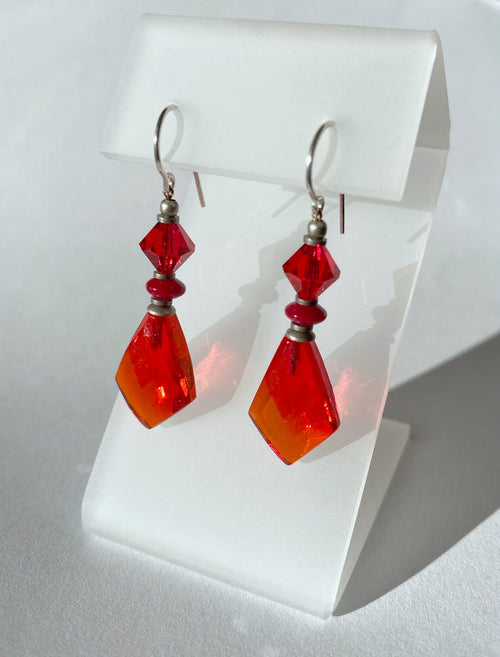 Red glass earrings from Owen Glass Collection, featuring vibrant, handcrafted glass earrings with a bold red color.