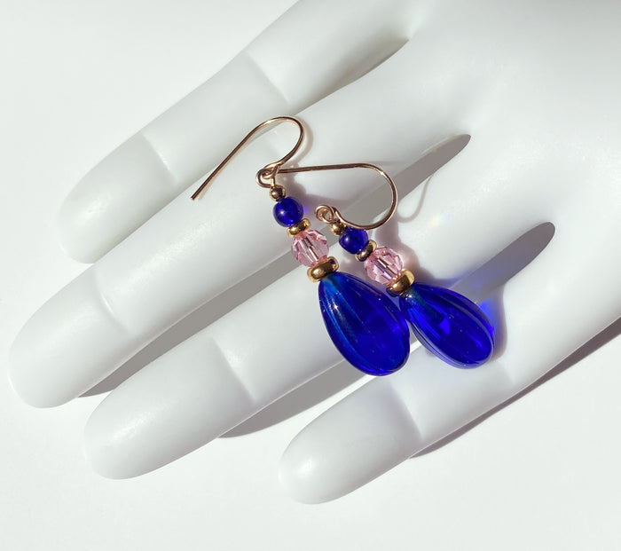 Owen Glass Collection cobalt and pink gold dangle earrings with sleek, elegant design and shiny finish.