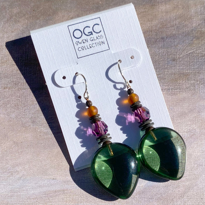 Owen Glass Collection almond-shaped green glass dangle earrings with amethyst crystal accents and silver hooks.