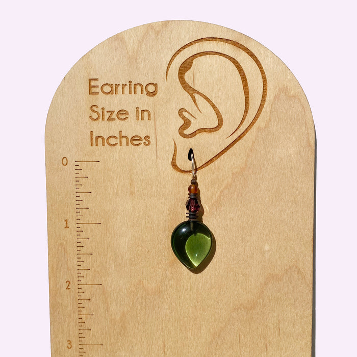 Owen Glass Collection Almonds 13 green glass dangle earrings with amethyst crystal accents and tourmaline green details.
