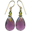 A pair of teardrop-shaped drop earrings with faceted purple amethyst stones, olive green beads, and gold-filled wire hooks, shown against a plain white background.