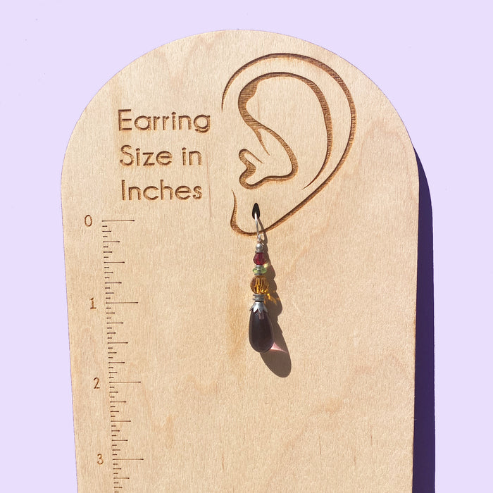 Owen Glass Collection earrings featuring elegant glass design with intricate details, shown in a close-up photograph.