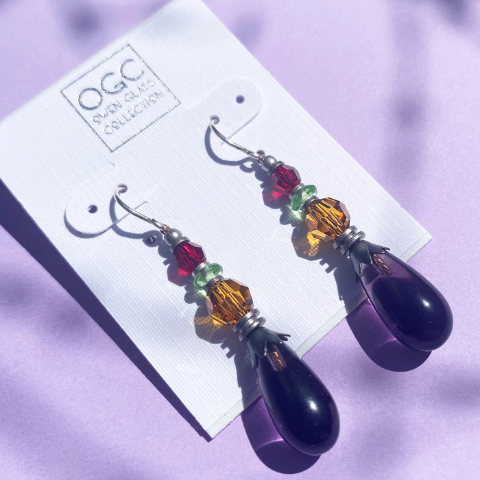 Owen Glass Collection earrings featuring intricate glass designs with elegant, handcrafted details, showcased in the image.