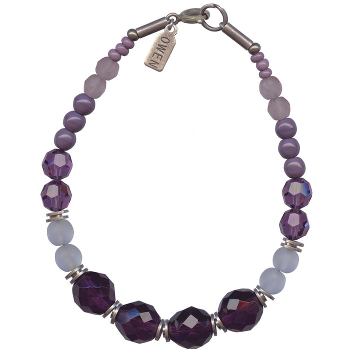 Beaded glass bracelet with amethyst tones from Owen Glass Collection, featuring purple and lavender beads on a stretch cord.