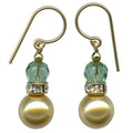 Owen Glass Collection Bells 19 earrings featuring textured bell-shaped silver design on a white background.