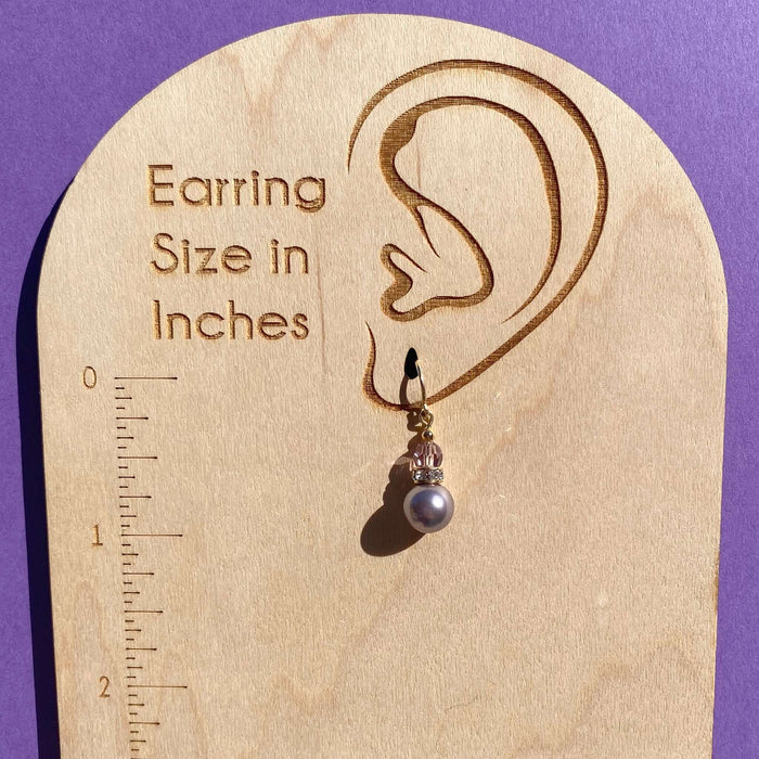 Owen Glass Collection Bells 57 light amethyst crystal pearl earrings with gold trim, dangling with elegant gemstone details.
