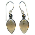 Owen Glass Collection Birdsong 13 earrings featuring delicate bird and floral designs in silver.