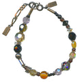 Black and tan bracelet from Owen Glass Collection featuring mixed leather and metal accents on a stylish design.