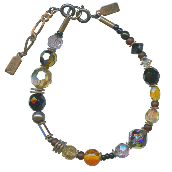 Black and tan bracelet from Owen Glass Collection featuring mixed leather and metal accents on a stylish design.