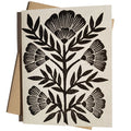 Black block printed flower greeting card from Owen Glass Collection with intricate floral design.