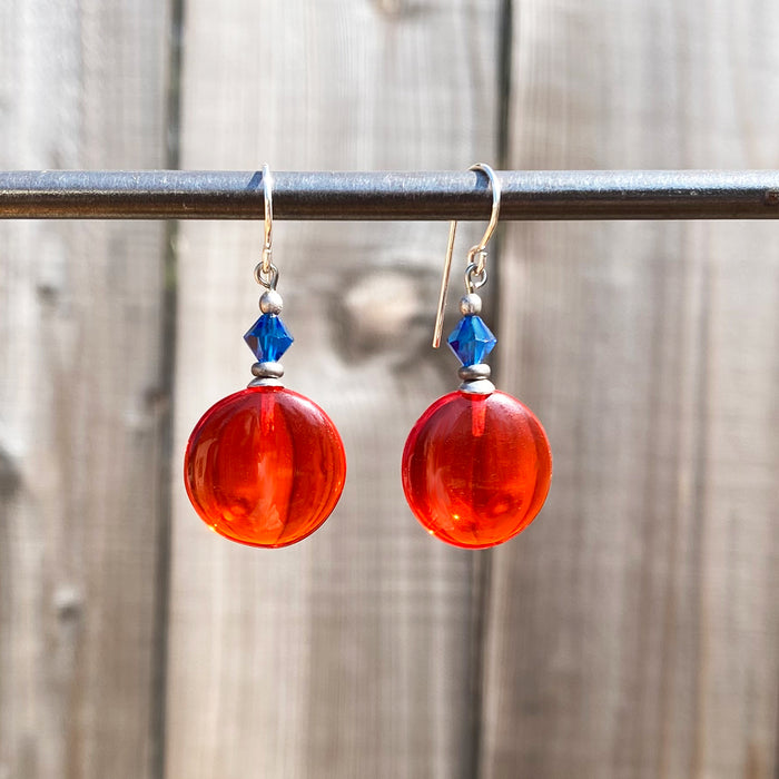 Bright orange and blue crystal dangle earrings from Owen Glass Collection featuring window-inspired design and sparkling crystal details.