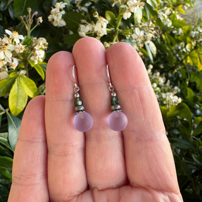 Frosted periwinkle glass and green crystal earrings from Owen Glass Collection featuring bubble-like designs and elegant dangle style.