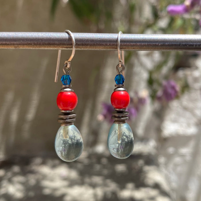 Owen Glass Collection chimes 10-inch aquamarine glass dangle earrings with shimmering, handcrafted glass beads and silver hooks.