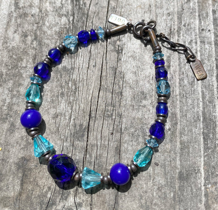 Cobalt blue Czech glass and aqua crystal bracelet from Owen Glass Collection, featuring vibrant glass beads and elegant design.
