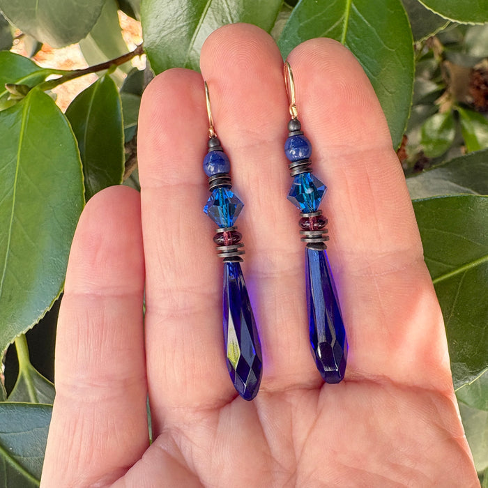 Cobalt blue glass chandelier earrings from Owen Glass Collection with intricate design and dangling blue glass beads.