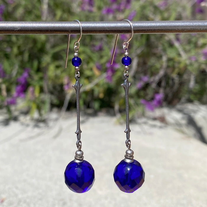 Owen Glass Collection earrings featuring elegant glass design with intricate details and a polished finish.