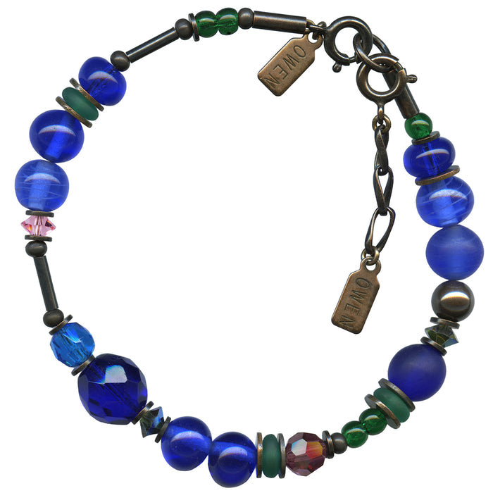 Cobalt and emerald crystal beaded bracelet from Owen Glass Collection, featuring elegant round beads and a stylish design.