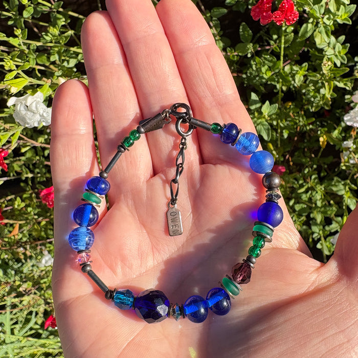 Cobalt and emerald crystal beaded bracelet from Owen Glass Collection with intricate beading and elegant design.