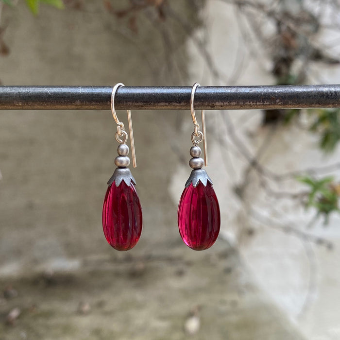 Dark pink German glass drop earrings featuring seedpod design from the Owen Glass Collection.