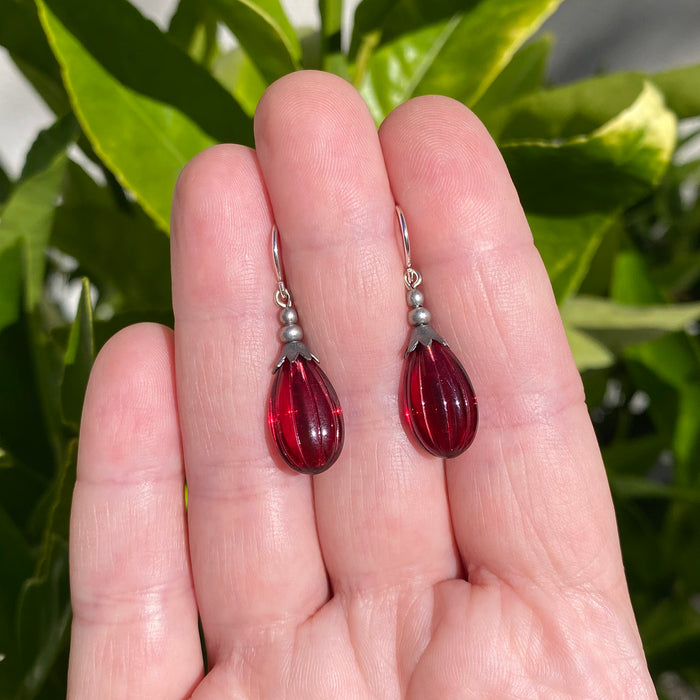 Dark pink German glass drop earrings with seedpod design from Owen Glass Collection, featuring intricate glass craftsmanship.