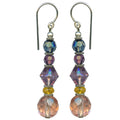 Owen Glass Collection FAUNA 4 earrings featuring intricate animal-inspired metal design on a neutral background.