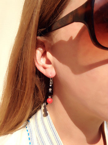 Owen Glass Collection FAUNA 6 earrings featuring intricate animal-inspired design in polished metal.