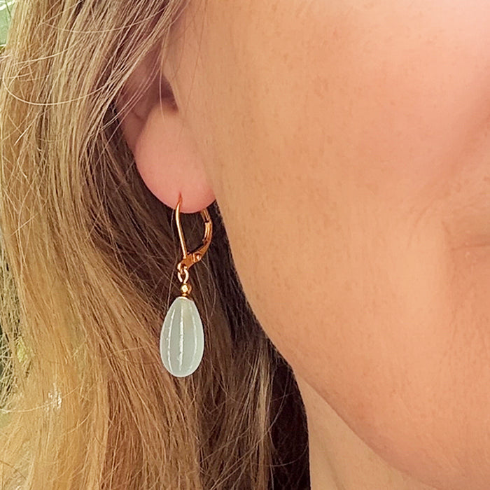 Frosted aqua glass and gold earrings featuring seedpod design from Owen Glass Collection, showcasing elegant jewelry details.