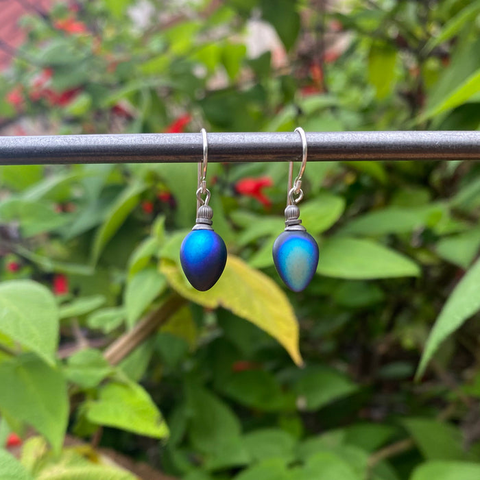 Frosted iridescent jet glass drop earrings with mini berry design by Owen Glass Collection, hanging from silver hooks.