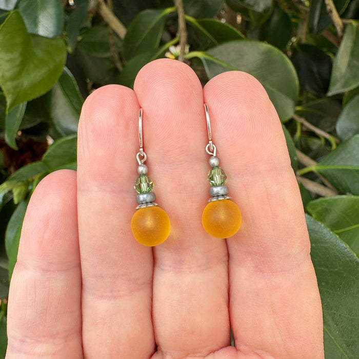 Frosted Jonquil glass and peridot crystal drop earrings from Owen Glass Collection featuring bubble-shaped design.