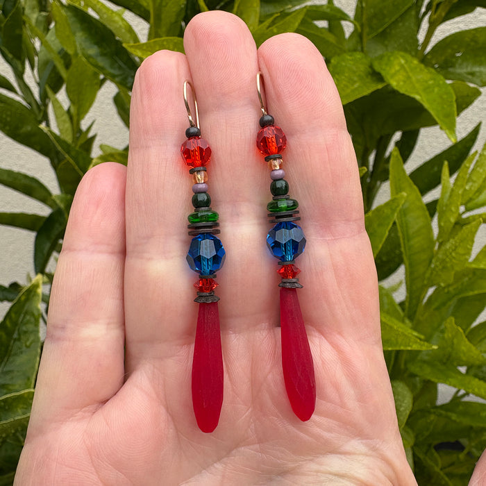 Frosted red Czech glass earrings from Owen Glass Collection featuring "Flying Down to Rio" design, showcasing elegant handcrafted jewelry.