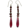 Owen Glass Collection Metro 13 earrings with sleek geometric design in polished metal, displayed on a neutral background.