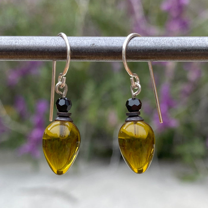 Green glass and jet crystal dangle earrings from Owen Glass Collection with elegant plum-shaped design.