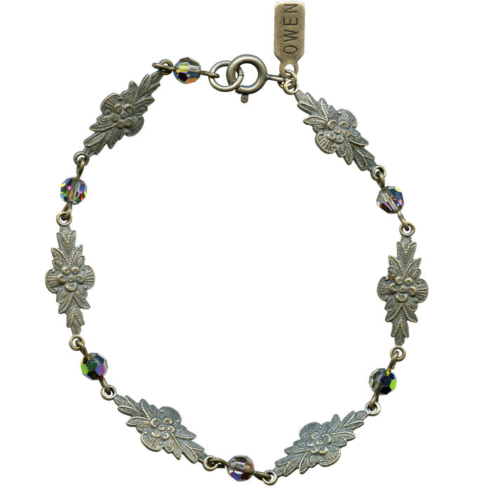 Iridescent Austrian crystal bracelet with intricate filigree design from Owen Glass Collection, showcasing shimmering elegance.