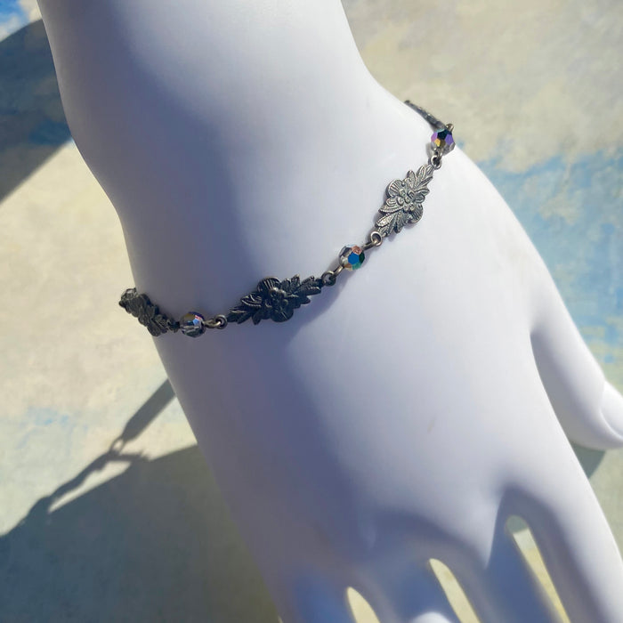 Iridescent Austrian crystal bracelet with intricate filigree design from Owen Glass Collection, showcasing sparkling craftsmanship.
