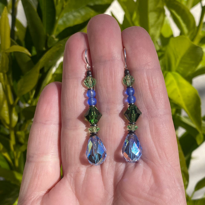 Iridescent light sapphire crystal earrings with bronze accents from Owen Glass Collection, showcasing elegant, sparkling jewelry design.