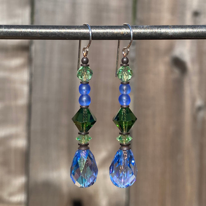 Iridescent light sapphire crystal earrings from Owen Glass Collection, showcasing shimmering gemstone design and elegant style.