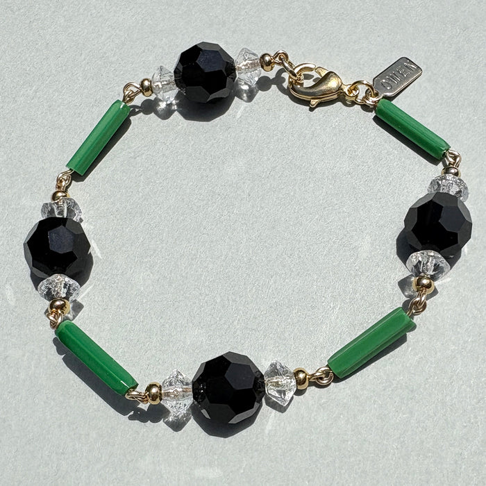 Jade and Jet Crystal Bracelet by Owen Glass Collection featuring green jade and black jet glass beads on a stretch cord.