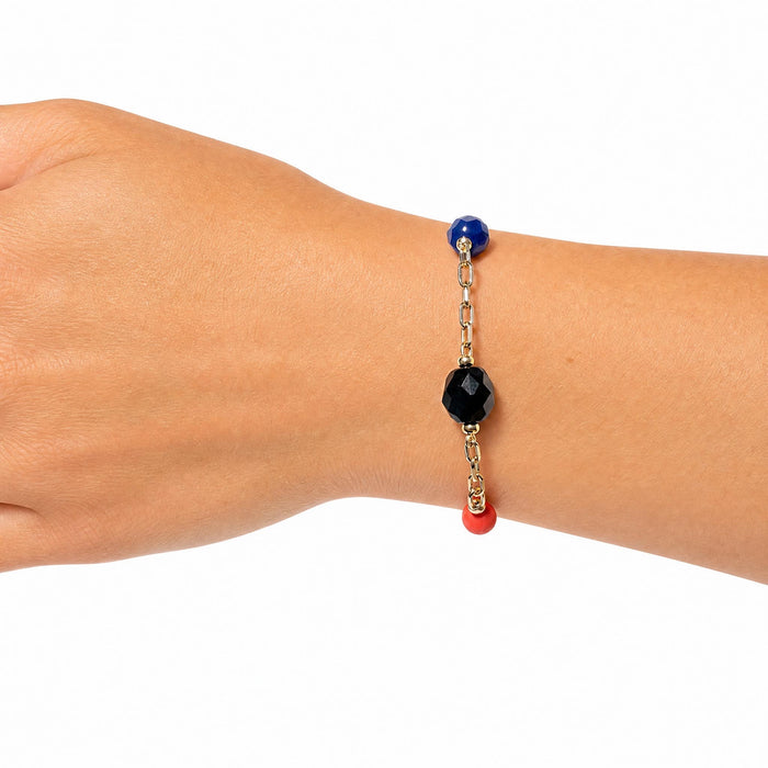 Cobalt and coral Czech glass bracelet from Owen Glass Collection featuring jet-colored glass beads and intricate design.