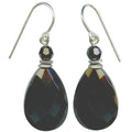 A pair of teardrop-shaped black faceted drop earrings with small black beads and silver French hook wires, shown against a plain white background.