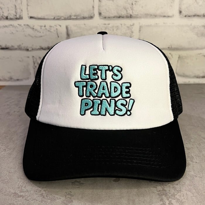 Black and white trucker hat with 'LET'S TRADE PINS!' text