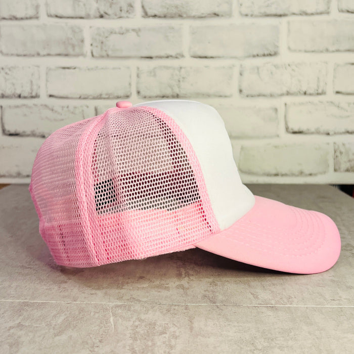Pink and white trucker hat with mesh back