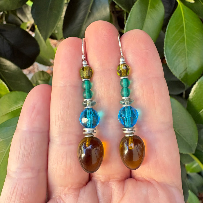Olive green glass earrings from Owen Glass Collection with rounded, smooth surface and elegant design.