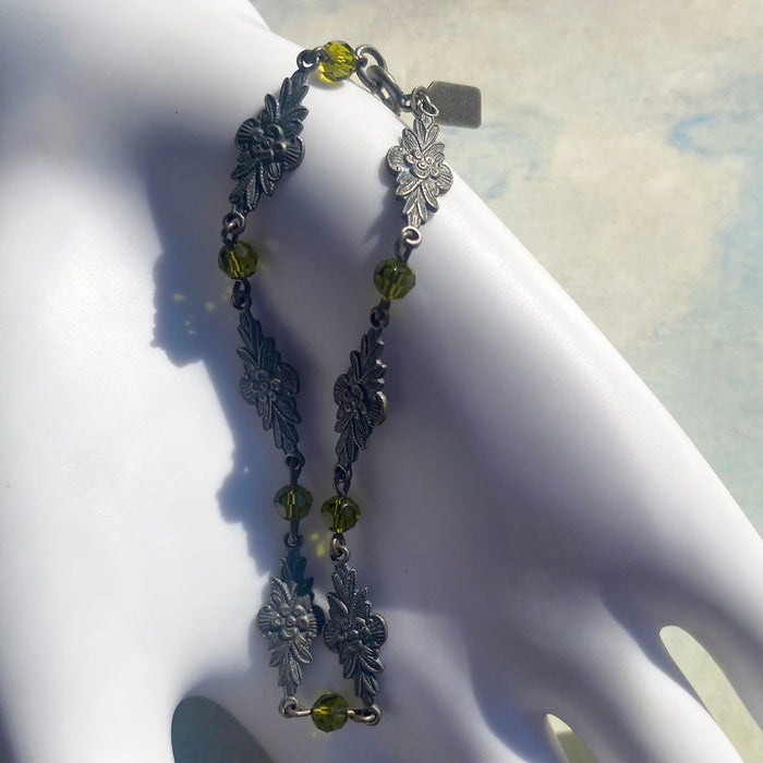 Olivine Austrian crystal bracelet with intricate filigree design from Owen Glass Collection, named Grace 7, displayed on a white background.
