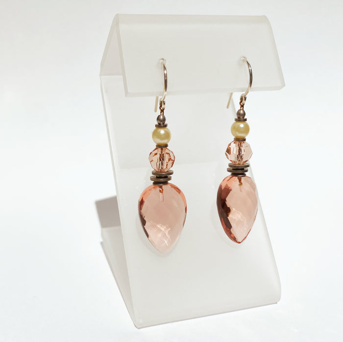 Owen Glass Collection earrings featuring elegant glass hoops with intricate detailing, displayed on a neutral background.