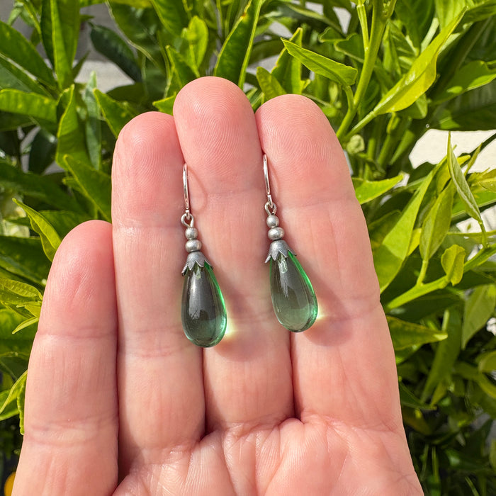 Peridot green German glass and silver drop earrings from Owen Glass Collection, showcasing elegant silver and vibrant green glass beads.