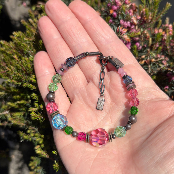Pink and aqua crystal beaded bracelet from Owen Glass Collection with "Time Scales" design, featuring sparkling beads and intricate details.