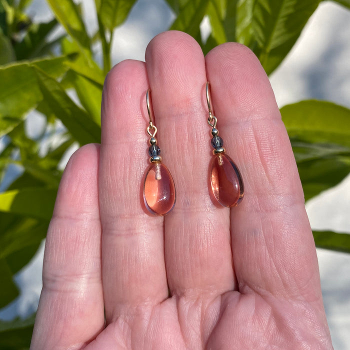 Owen Glass Collection Raindrops 130 light topaz glass, indigo crystal and gold earrings with a delicate, elegant design.