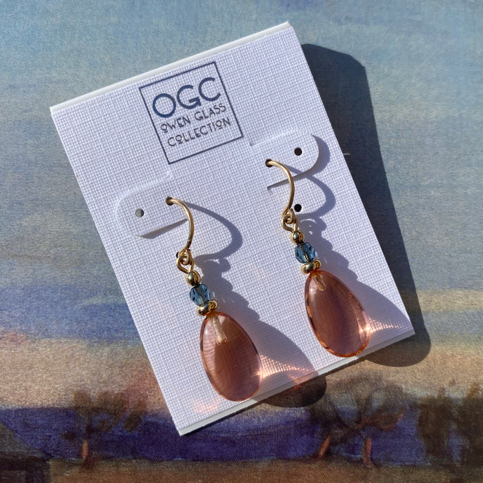 Owen Glass Collection Raindrops 130 earrings featuring light topaz glass, indigo crystal, and gold accents.